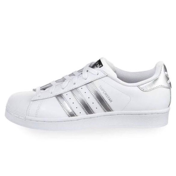 white adidas trainers with silver stripes